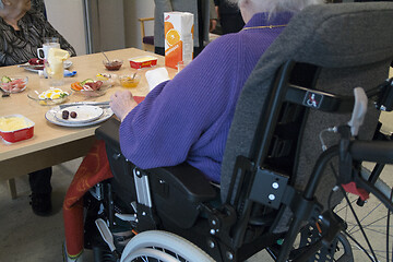 Image showing Wheelchair by the Table