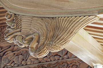 Image showing Wooden carving of crane decorates the gable of a roof over the entrance of an ancient Buddhist temple in Japan.