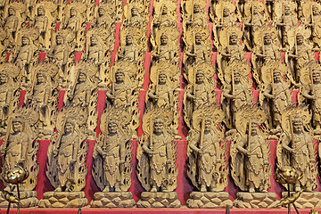 Image showing Little wooden statues in ancient japanese shrine