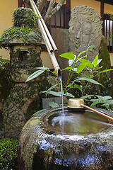 Image showing Traditional japanese bamboo purification fountain for purification at entrance of the Japanese temple.