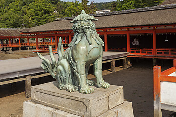 Image showing Bronze statue of Komainu traditional japanese guardian lion dog, in Itsukushima Shrine in Japan.