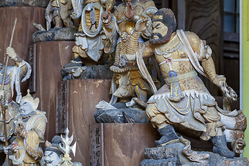 Image showing Little wooden statues in ancient japanese shrine