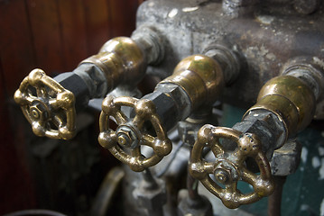 Image showing Three brass valves