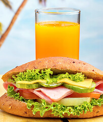 Image showing Juice And Sandwich Represents Orange Drink And Beach 