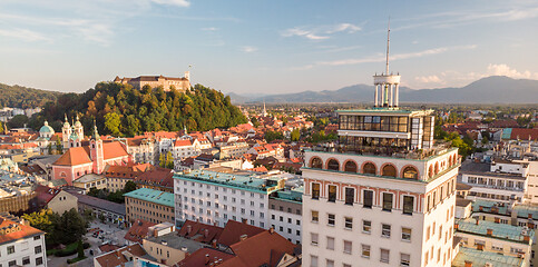 Image showing Cityscape of Ljubljana, capital of Slovenia, and it\'s old skyscraper in warm afternoon sun.