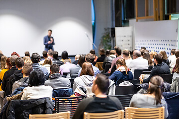 Image showing Business speaker giving a talk at business conference event.