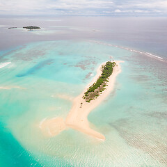 Image showing Picture perfect beach and turquoise lagoon on small tropical island on Maldives