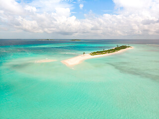 Image showing Picture perfect beach and turquoise lagoon on small tropical island on Maldives