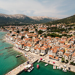 Image showing Aerial panoramic view of Baska town, popular touristic destination on island Krk, Croatia, Europe.