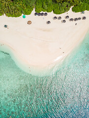 Image showing Aerial drone view of picture perfect beach and turquoise lagoon on small tropical island on Maldives