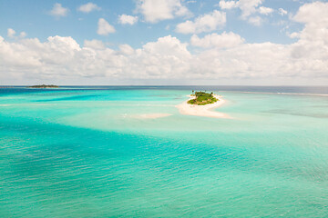 Image showing Picture perfect beach and turquoise lagoon on small tropical island on Maldives