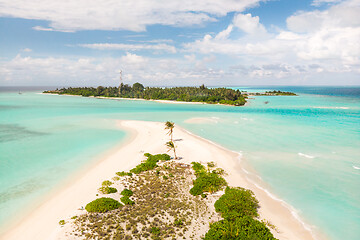 Image showing Picture perfect beach and turquoise lagoon on small tropical island on Maldives