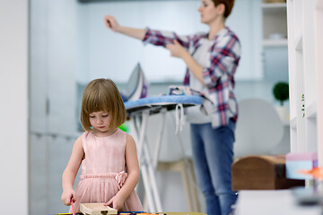 Image showing mother and daughter spending time together at home