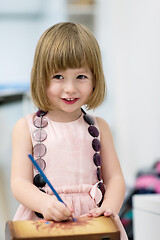 Image showing little girl painting jewelry box