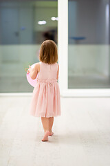 Image showing cute little girl playing with balloons