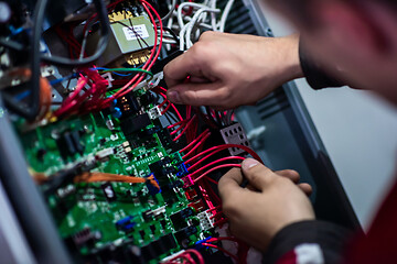 Image showing electrician engineer working with electric cable wires