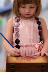 Image showing little girl painting jewelry box