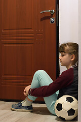 Image showing Girl sitting in the hallway and waiting for the end of quarantine