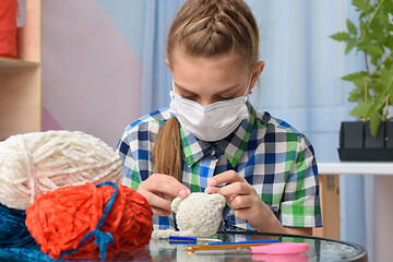 Image showing Teenager embroidering a house in self-isolation mode