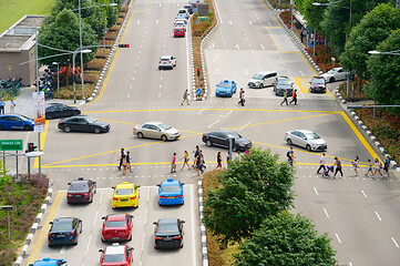 Image showing People crossing multilane road. Singapore