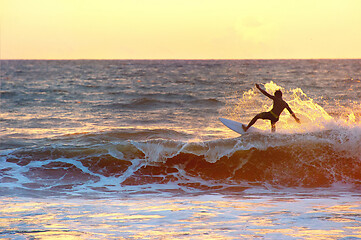 Image showing Surfer at sunset, silhouette