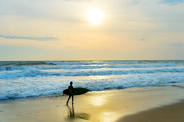 Image showing Young surfer on the beach