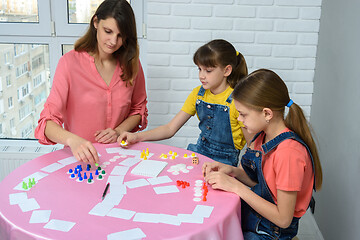 Image showing Mom and two daughters play board games