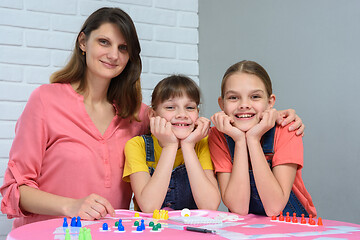 Image showing Portrait of a happy family playing board games at a table