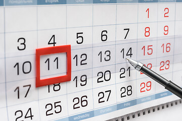 Image showing Pen indicates future friday on wall calendar