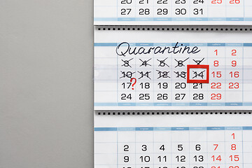 Image showing Calendar on a white wall with the inscription quarantine and crossed out days of the week