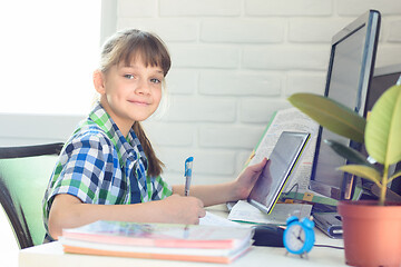 Image showing Girl does homework with a online services