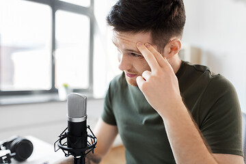 Image showing male audio blogger with microphone broadcasting