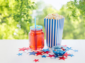 Image showing drink and popcorn with candies on independence day