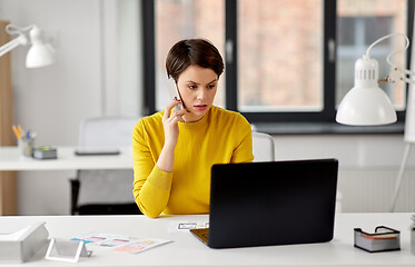 Image showing ui designer calling on smartphone at office