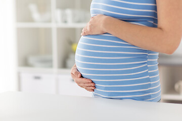 Image showing pregnant woman with big tummy at home