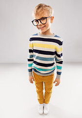 Image showing smiling boy in glasses and striped pullover