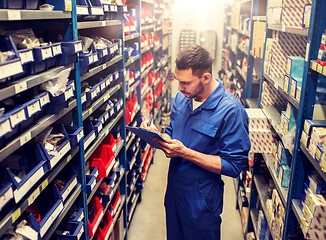 Image showing auto mechanic or smith with tablet pc at workshop