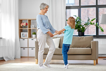 Image showing grandmother and granddaughter having fun at home