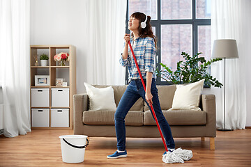 Image showing happy asian woman with mop cleaning floor at home