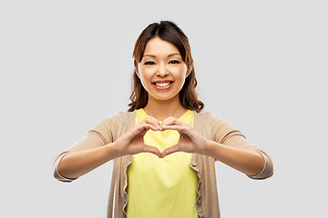 Image showing asian woman making hand heart gesture