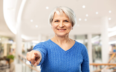 Image showing senior woman pointing finger to you