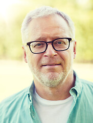 Image showing close up of senior man in glasses outdoors