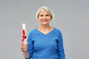 Image showing happy senior graduate student woman with diploma