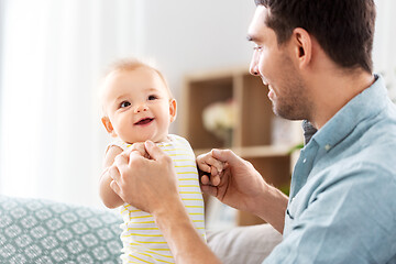 Image showing father with little baby daughter at home