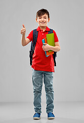 Image showing student boy with books and bag showing thumbs up