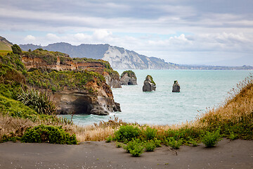 Image showing sea shore rocks and mount Taranaki, New Zealand