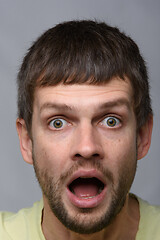 Image showing Close-up portrait of a very surprised man of European appearance