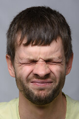 Image showing Close-up portrait of a squinted eye of a man of European appearance