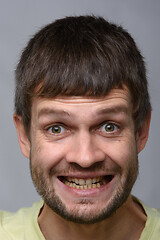 Image showing Closeup portrait of an insanely joyful man of European appearance