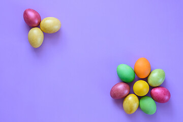 Image showing Easter beautiful eggs in the shape of flowers on a purple background